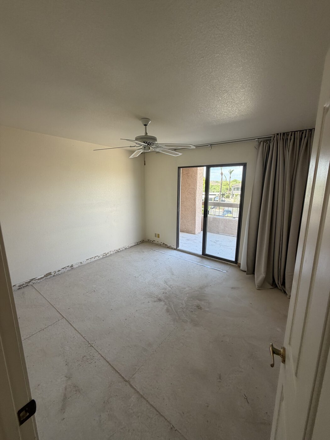 The same room cleared out and swept to bare slab after all demolition debris was hauled away